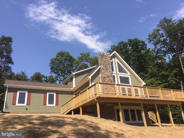 back of property with a deck