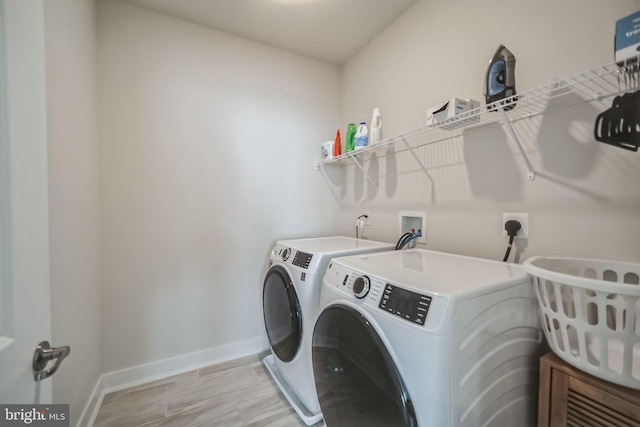 laundry area with separate washer and dryer