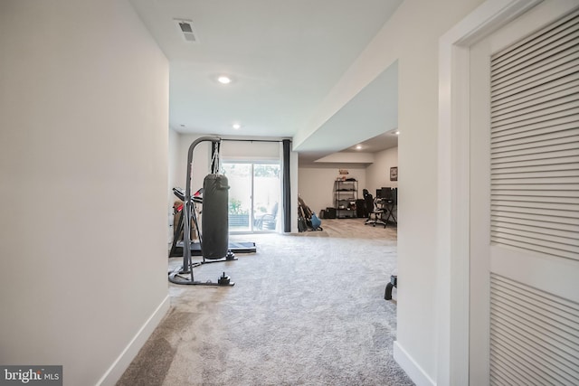 exercise area featuring carpet flooring