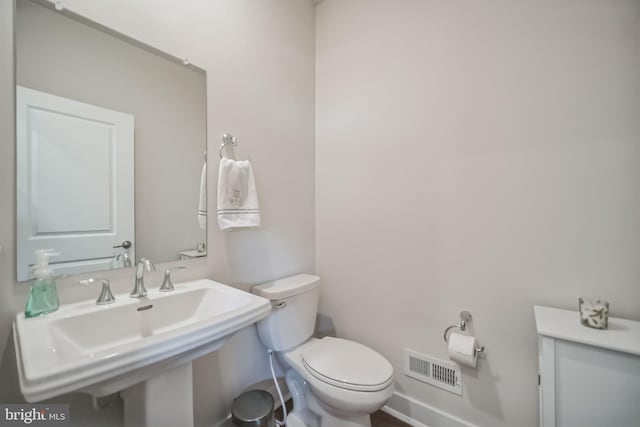 bathroom featuring sink and toilet