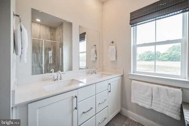 bathroom with vanity and an enclosed shower