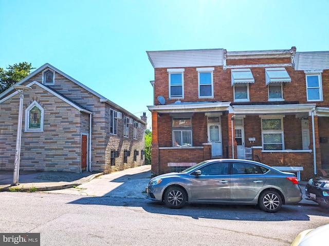 view of property featuring brick siding