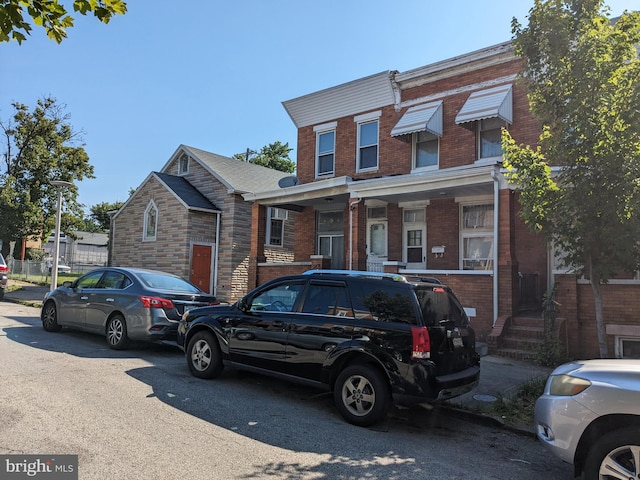 townhome / multi-family property with brick siding