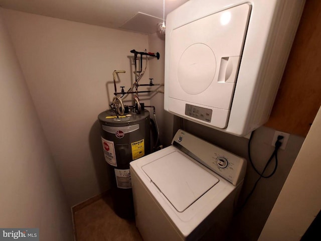 laundry room featuring electric water heater and stacked washer / drying machine