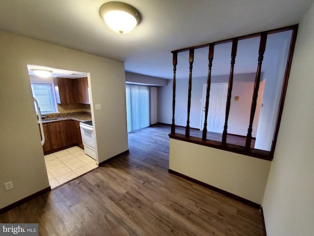 kitchen featuring stove and light hardwood / wood-style floors