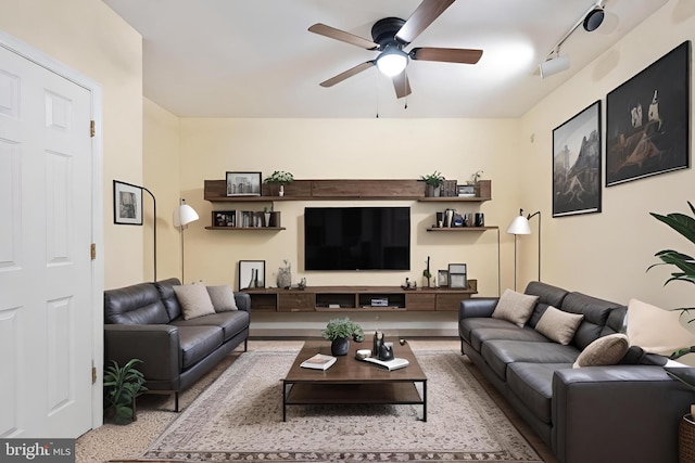 living room featuring ceiling fan and track lighting