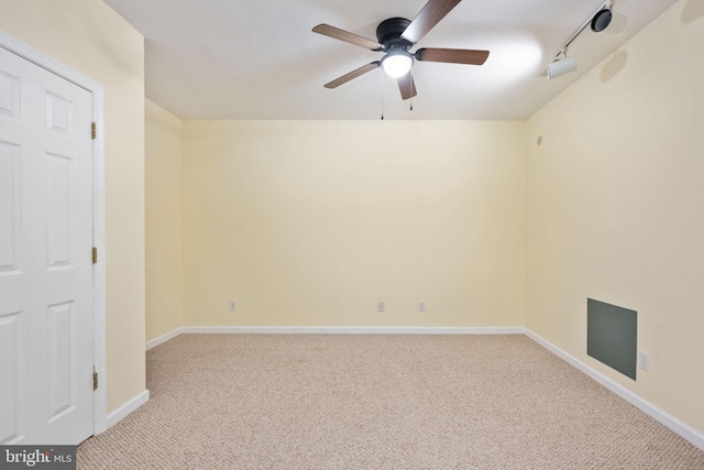 unfurnished room featuring ceiling fan and light colored carpet