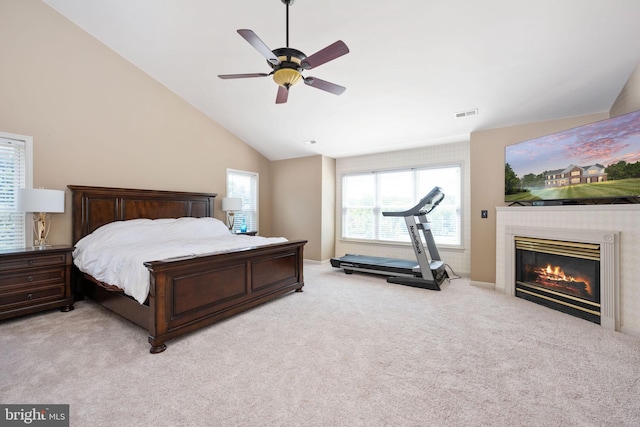 bedroom featuring ceiling fan, high vaulted ceiling, and light colored carpet