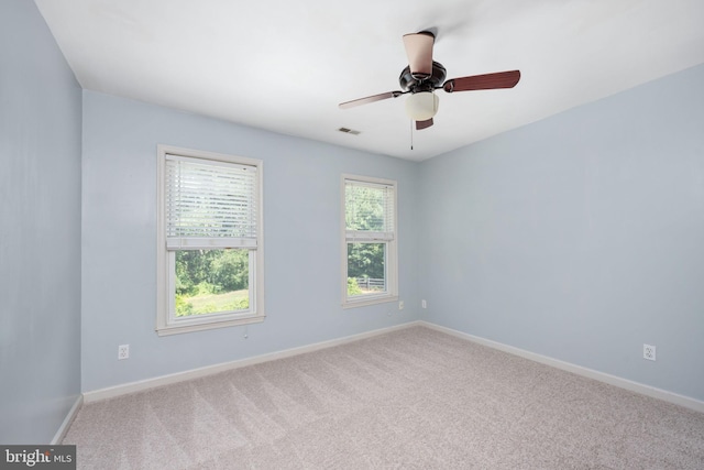 carpeted empty room with ceiling fan