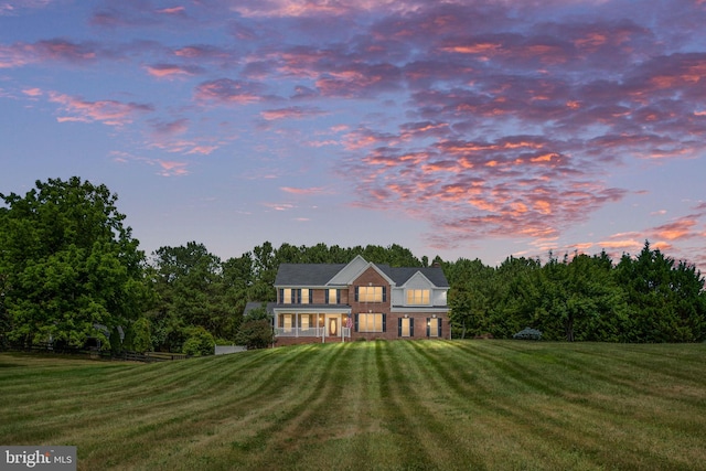 view of front of home with a yard