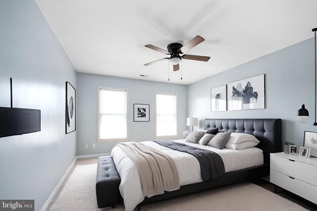 carpeted bedroom featuring ceiling fan