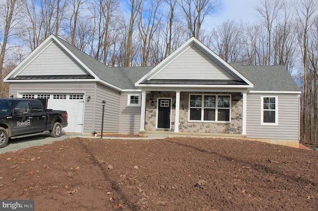 craftsman-style home featuring a garage and covered porch