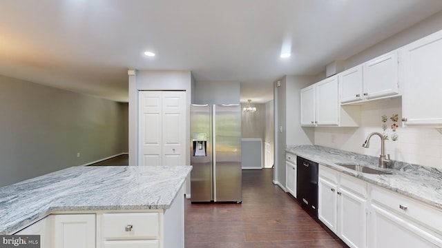 kitchen featuring sink, dishwasher, white cabinetry, stainless steel refrigerator with ice dispenser, and light stone counters