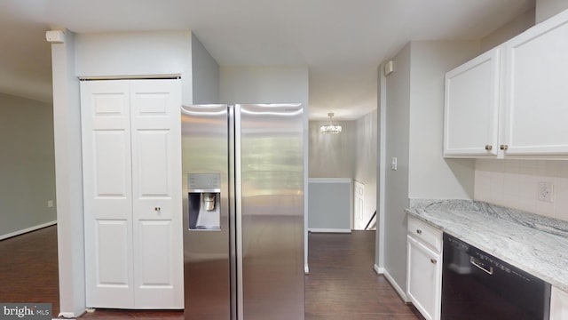 kitchen featuring dishwasher, white cabinets, stainless steel fridge, light stone counters, and dark wood-type flooring