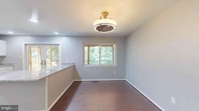 interior space featuring french doors and dark hardwood / wood-style floors