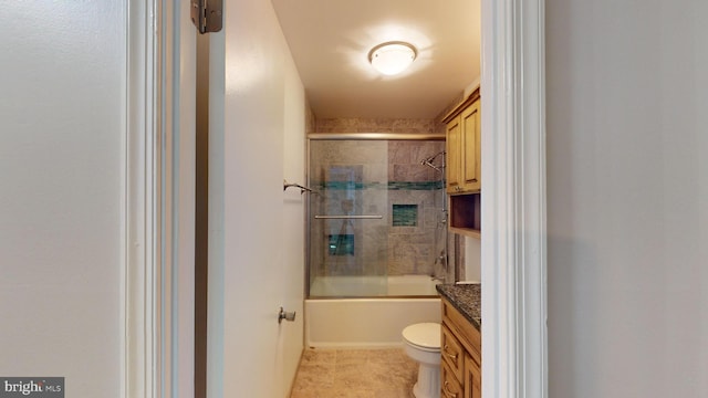 full bathroom featuring enclosed tub / shower combo, vanity, tile patterned flooring, and toilet