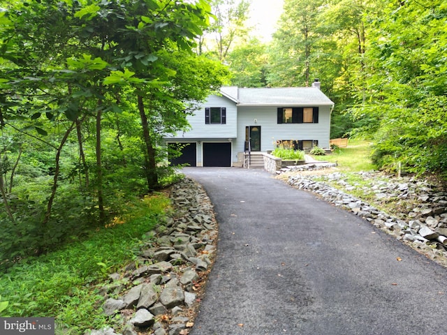 split foyer home featuring a garage