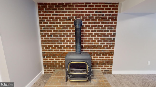 details with a wood stove and carpet flooring