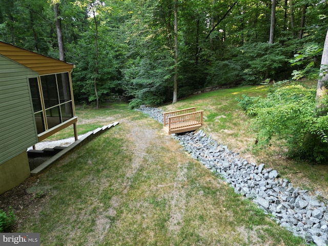 view of yard featuring a sunroom