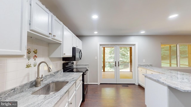 kitchen with white cabinetry, light stone countertops, sink, and black appliances