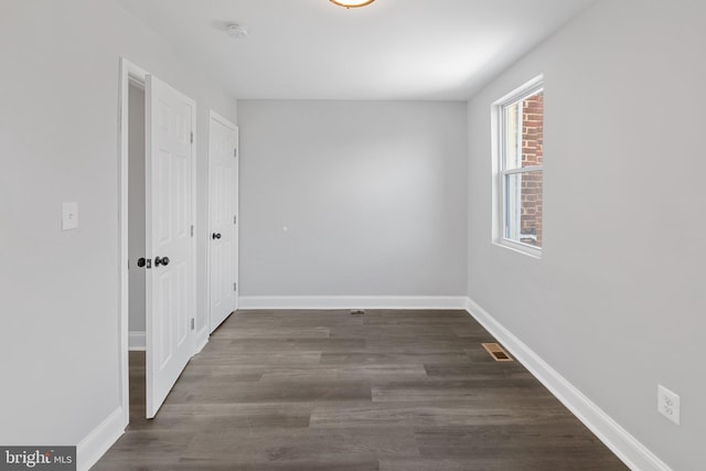 corridor with dark wood-type flooring