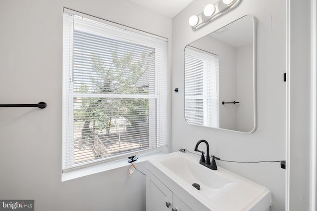 bathroom featuring vanity and a healthy amount of sunlight