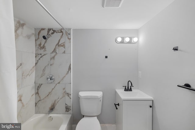 full bathroom featuring vanity, toilet, and tiled shower / bath