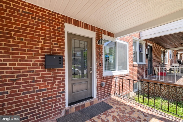 doorway to property featuring covered porch