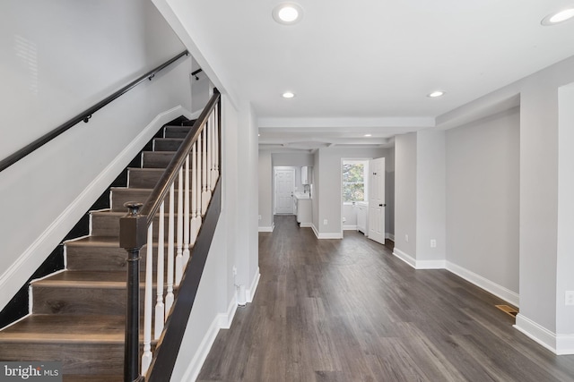 staircase featuring hardwood / wood-style flooring