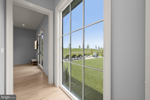 hall with light hardwood / wood-style flooring