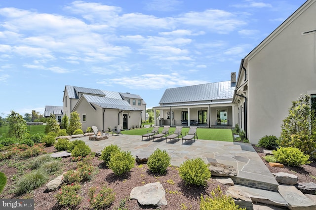 rear view of house featuring a patio