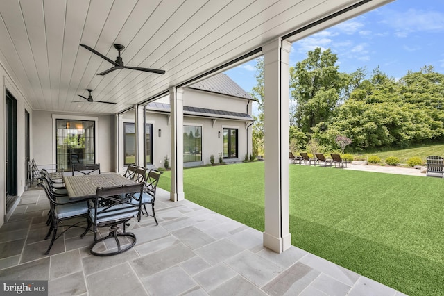 view of patio featuring ceiling fan