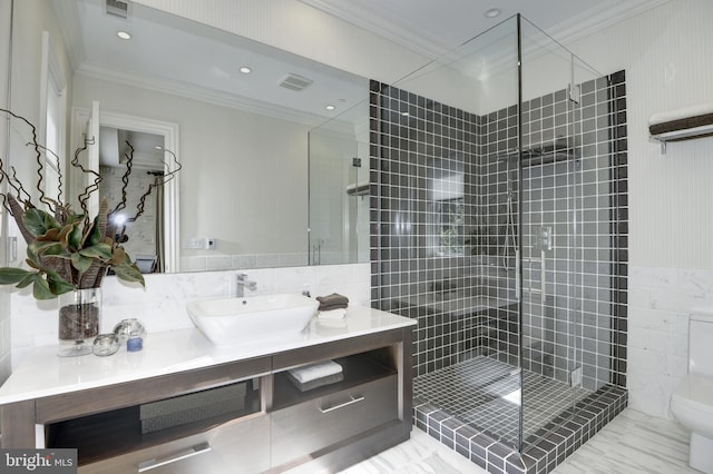 bathroom featuring ornamental molding, an enclosed shower, vanity, and toilet