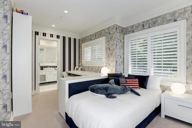 bedroom with ornamental molding, ensuite bath, and multiple windows