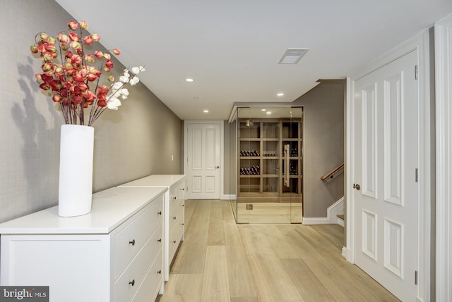 corridor featuring light hardwood / wood-style flooring