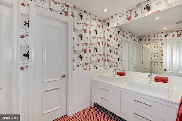 bathroom featuring vanity, tile walls, and tile patterned floors