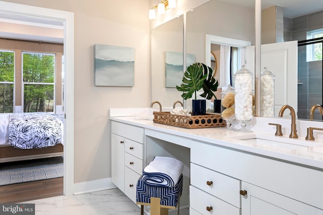 bathroom with vanity and hardwood / wood-style flooring