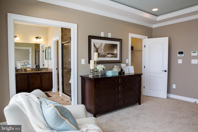 living area featuring light carpet, crown molding, and sink