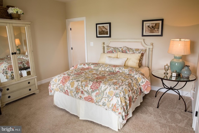 bedroom with light colored carpet