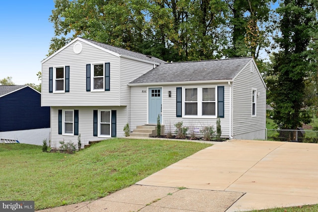 split level home with a front yard