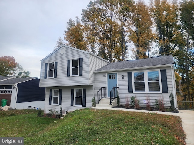 split level home with a front yard