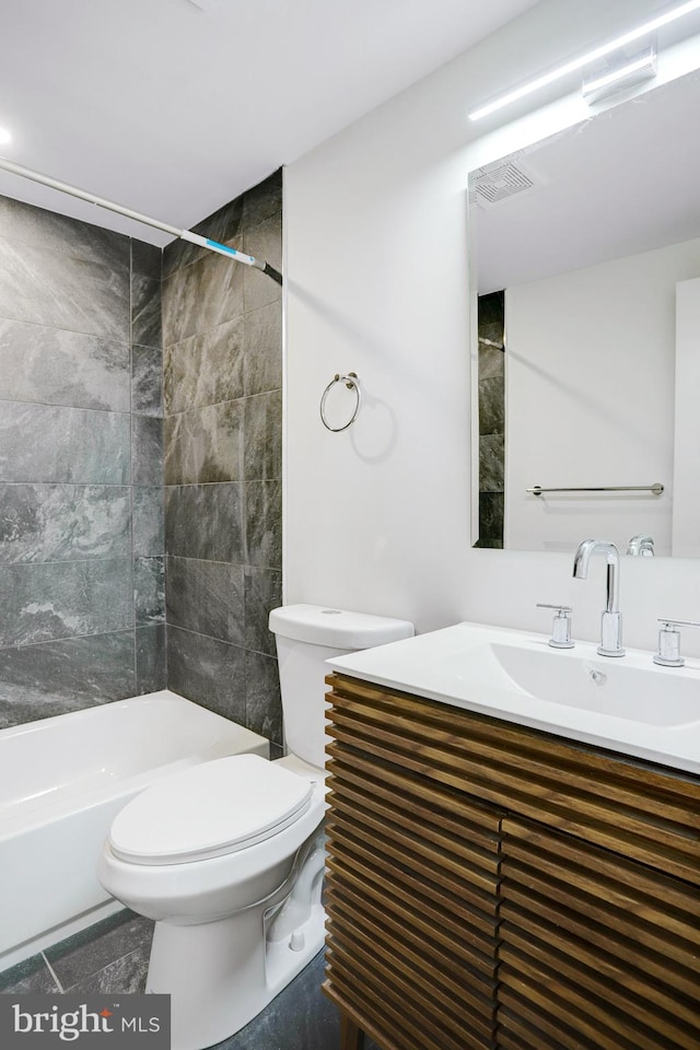 bathroom featuring tile patterned floors, vanity, and toilet