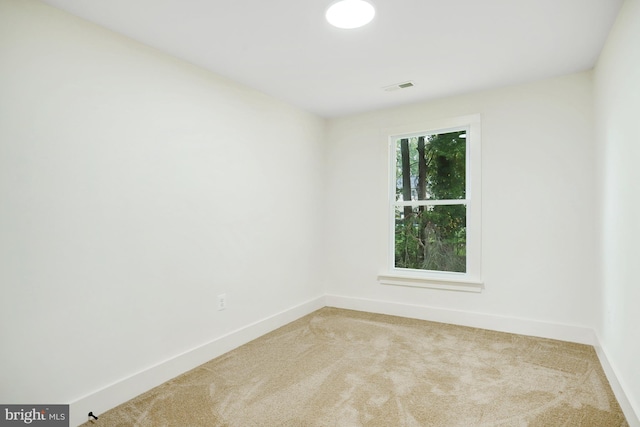 empty room featuring carpet flooring