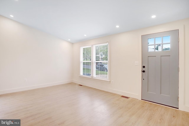 entryway featuring light hardwood / wood-style flooring and a healthy amount of sunlight