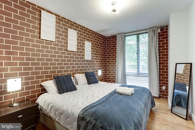 bedroom with light hardwood / wood-style flooring