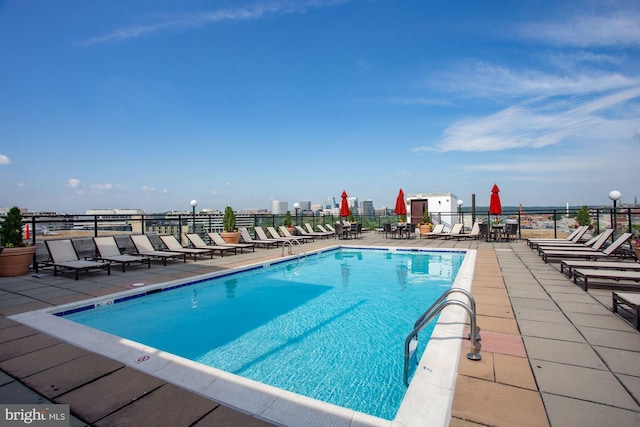 view of swimming pool featuring a patio