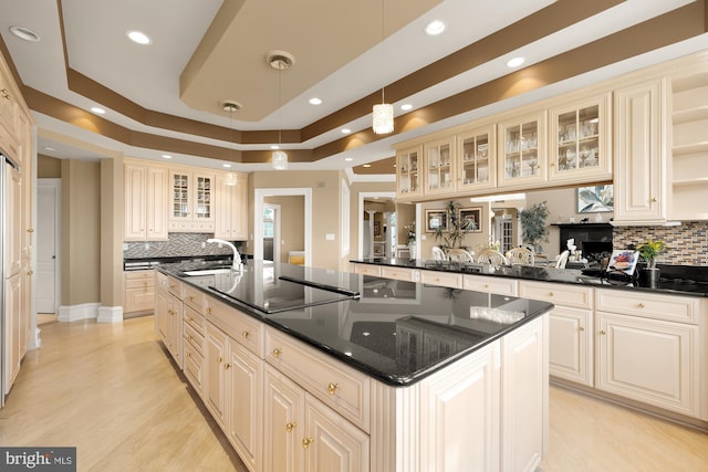 14950 Kelley Farm, Darnestown, MD 20874 - kitchen featuring black electric cooktop, cream cabinetry, recessed lighting, an island with sink, and tasteful backsplash