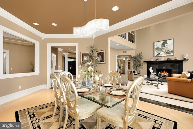 14950 Kelley Farm, Darnestown, MD 20874 - dining room featuring recessed lighting, crown molding, a lit fireplace, and ornate columns