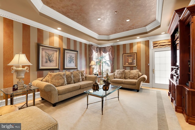 living room featuring a tray ceiling, crown molding, plenty of natural light, and light carpet