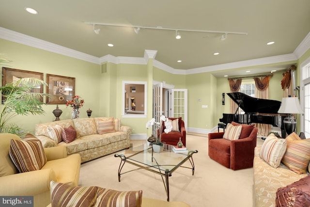 living room featuring light carpet, track lighting, and ornamental molding